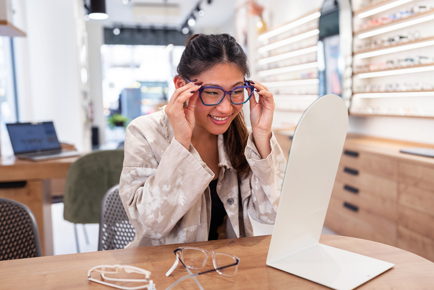 Woman trying on glasses