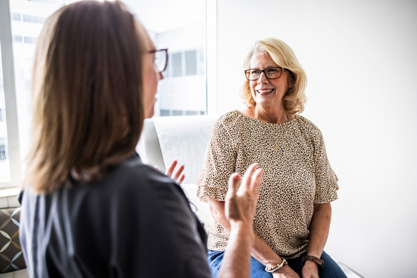 Woman talking to doctor