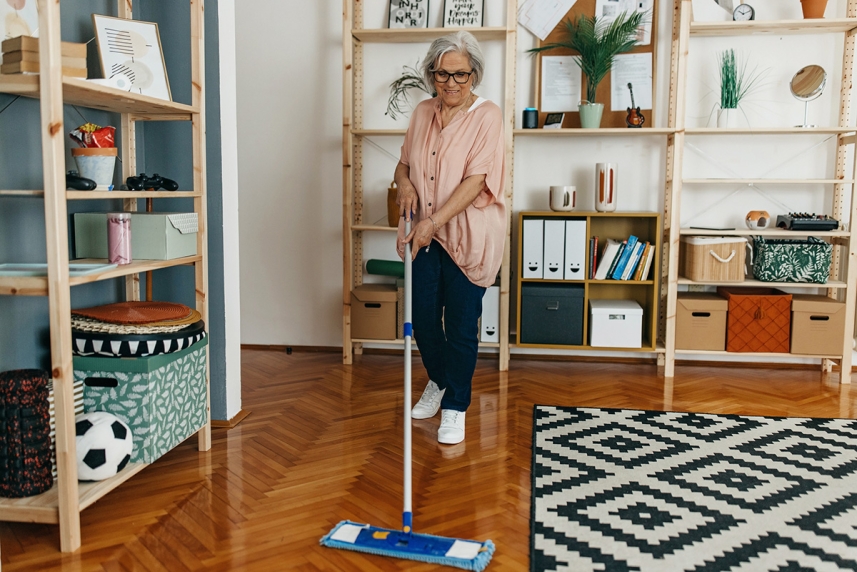 An older adult practicing fall prevention in her house