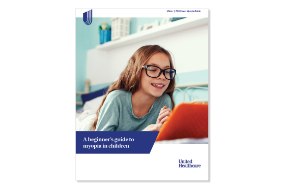 A child with glasses looking at tablet