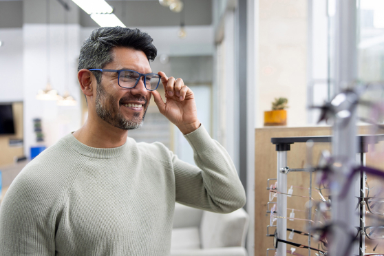 Man trying on glasses