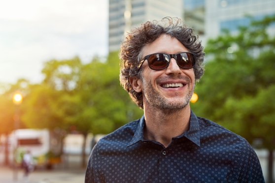 Adult man wearing polarized sunglasses 