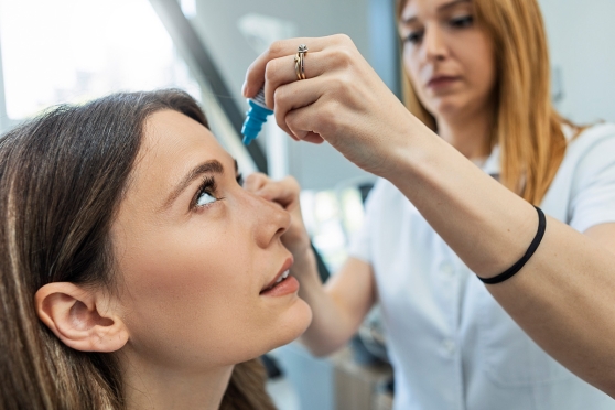 Woman using eyedrops